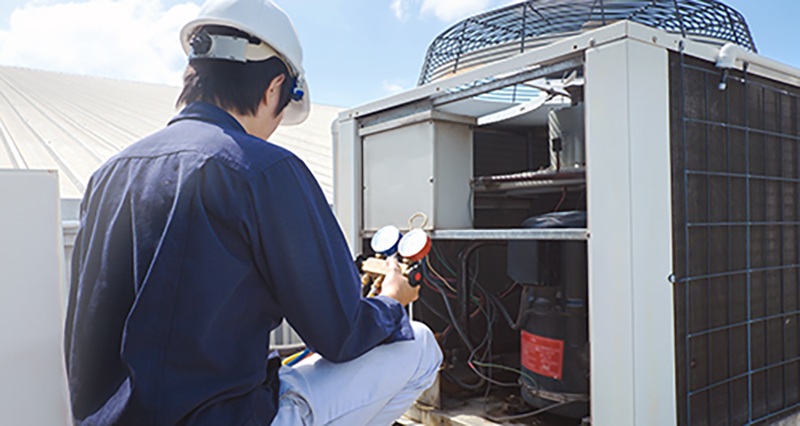 A man wearing a hard hat representing types of AC systems in Fort Collins, CO
